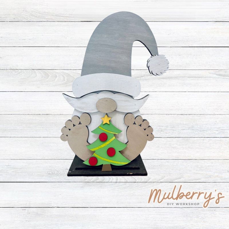 Our cute little interchangeable gnome sitter is a must! He measures 12-inches tall. Swap out his inserts to keep him ready for each holiday and season.

Includes interchangeable gnome with Christmas insert.