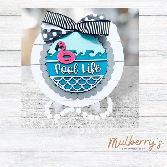 We love our large interchangeable plate with stand! It's approximately 11.5-inches is diameter and can display your favorite seasonal/holiday insert. This set includes the large interchangeable plate with stand and the pool life insert. Can also be customized to say "Beach Life."