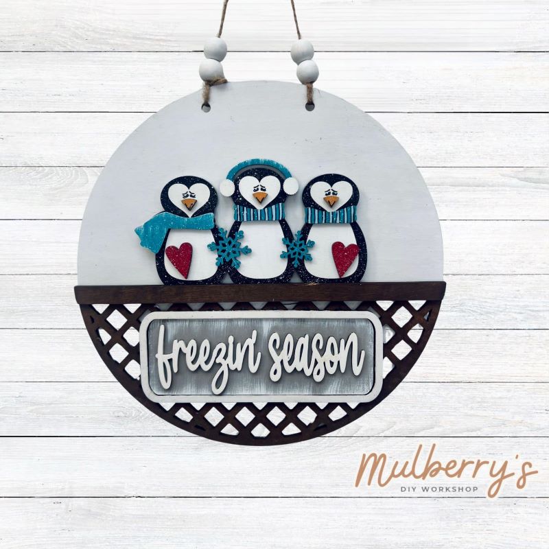 Welcome family and friends with our interchangeable lattice round door hanger! Simply swap out inserts to match the different holidays and seasons!

It's approximately 10.5" in diameter.

Includes: Lattice Round Door Hanger with Winter Penguin Inserts. Additional inserts are available to purchase.