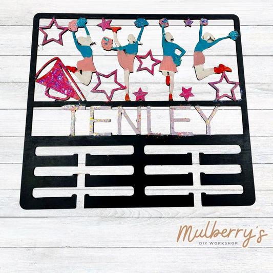 Display your awards with our personalized cheer medal holder! Approximately 15" tall by 15" wide.