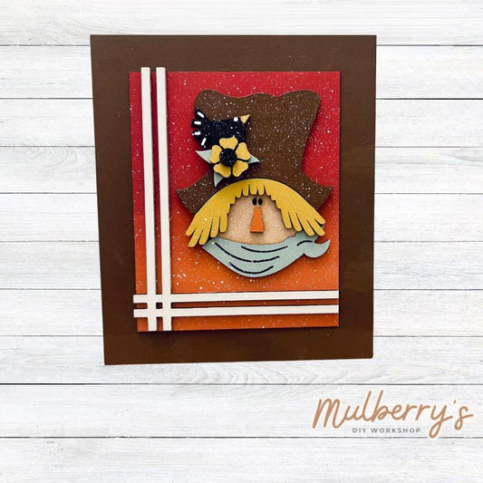 Our Interchangeable Rectangle Frame measures roughly 6.5" wide & 8" tall.

This project can easily be changed out for holidays, seasons and other themes. Because the frame leans back with the use of an easel, no magnets or adhesive hook and loop is needed.

The set includes the rectangle frame and scarecrow insert.