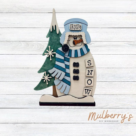Our stand-up Frosty snowman shelf sitter is snow-tastic! He's approximately 11" tall by 8" wide. Includes a stand.