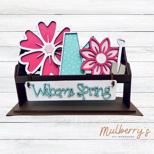 It doesn't get any cuter than our little rustic crate! It's a perfect add on accessory to your décor.  It's approximately 13" long.  Includes: Crate and Spring Flower Inserts. Spring Flower inserts include watering can, two flowers, gardening tool, and the Hello Spring banner.