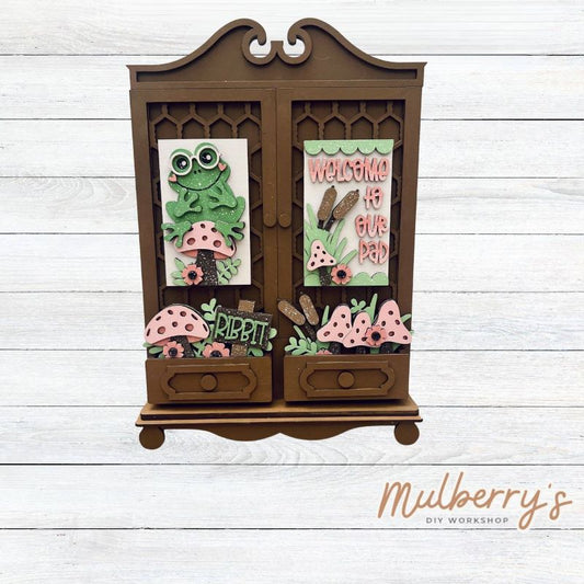 It doesn't get any cuter than our new double cottage mega shelf sitter! It's the perfect add-on accessory to your decor at approximately 16" tall by 11" wide.

Includes: Double Cottage and Spring Frog Inserts pictured.