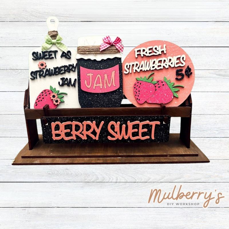 It doesn't get any cuter than our little rustic crate! It's a perfect add on accessory to your décor. It's approximately 13" long.

Includes: Crate and Strawberry Inserts.

Strawberry inserts include "Sweet as Strawberry Jam" cutting board, "Jam" jar, "Fresh Strawberries" round, and the "Berry Sweet" banner.