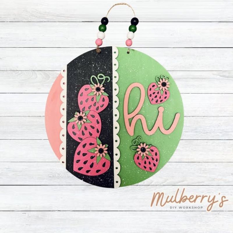 Greet friends and family this summer with our new berry-rrific strawberry "Hi" mini door hanger! Approximately 10.5" and includes your choice of either beads or a bow.