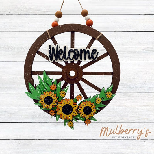 Our newest mini door hanger makes quite the impression! It's approximately 10.5" in diameter and includes your choice of either beads or a bow!