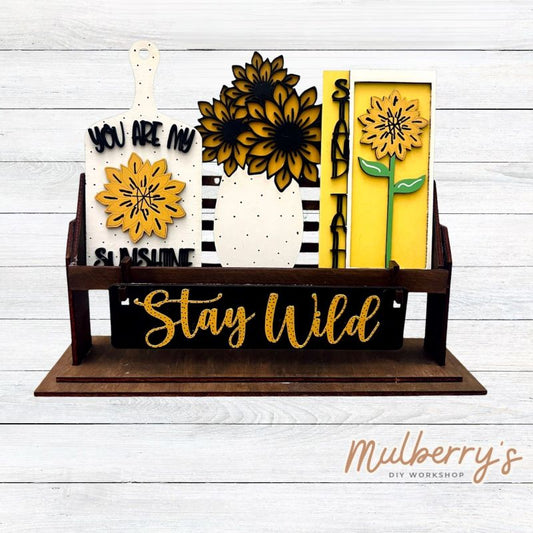 It doesn't get any cuter than our little rustic crate! It's a perfect add on accessory to your décor. It's approximately 13" long.

Includes: Crate and Sunflower Inserts.

Sunflower inserts include stand tall sign, sunflower vase, sunflower cutting board, and the Stay Wild banner.