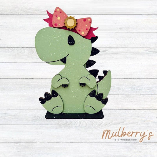 Our t-rex dinosaur is super cute! It's approximately 8" tall and can be paired with your favorite seasonal/holiday insert.

This set includes the interchangeable t-rex dinosaur and your choice of summer inserts:

-Headband with Bow Tie

-Headbow

-Tropical Flower Lei

Please note that different inserts fit each type of dinosaur base differently. For our interchangeable t-rex, we recommended pairing it with the headbow insert.