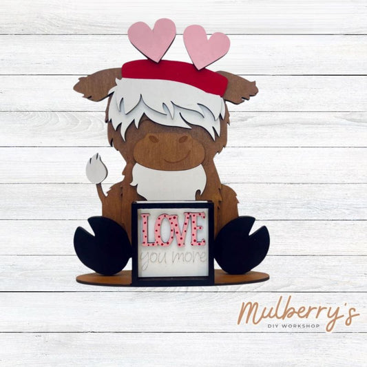 We love our interchangeable highland cow! It's approximately 9" tall and can be paired with your favorite seasonal/holiday insert. This set includes the interchangeable highland cow and the valentine inserts.