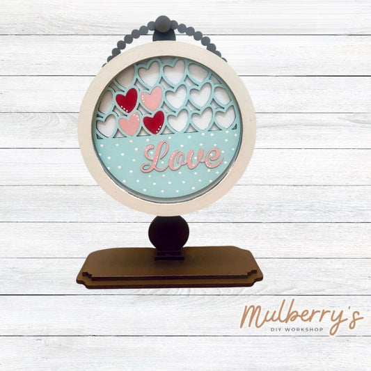We love our interchangeable tabletop! It's approximately 10" tall and can display your favorite seasonal/holiday insert. This set includes the interchangeable tabletop and the love insert.