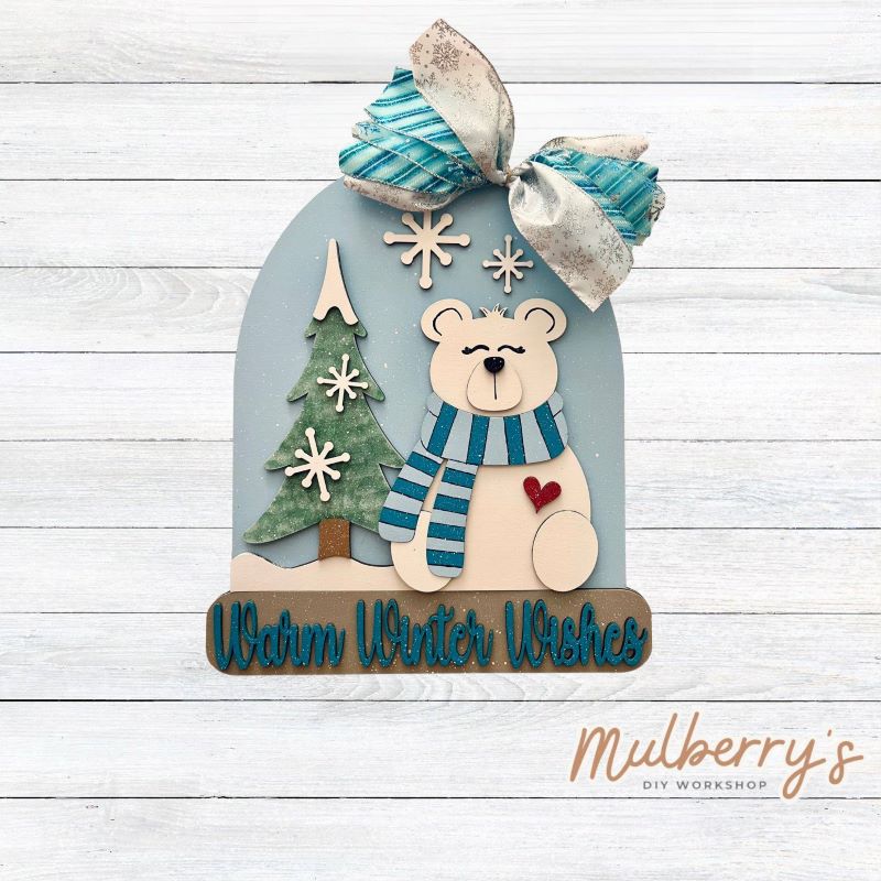 Greet guests with charm using this 18-inch "Warm Winter Wishes" door hanger. Includes your choice of either a bow or beads.