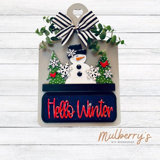 This Interchangeable Breadboard measures roughly 9" wide and  13.5" tall. This project can easily be changed out for holidays, seasons and other themes. Because the breadboard leans back with the use of an easel, no magnets or adhesive hook and loop is needed.