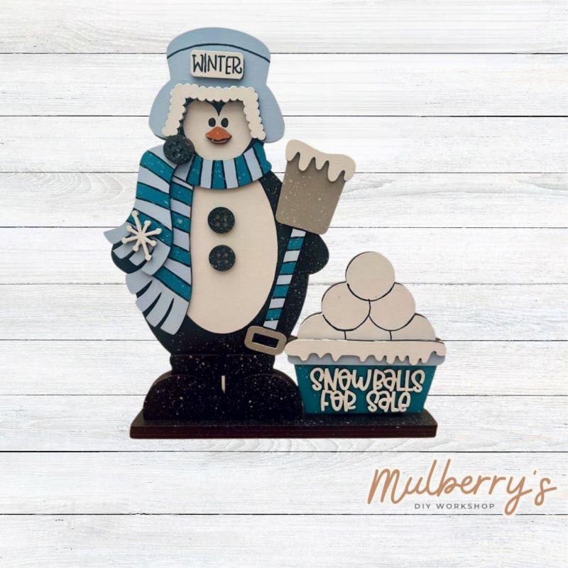 Snowballs For Sale! Our winter penguin shelf sitter is the perfect addition to your winter decor! Approximately 10.5" tall by 8" wide. Includes a stand.