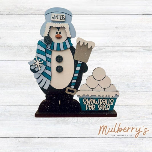 Snowballs For Sale! Our winter penguin shelf sitter is the perfect addition to your winter decor! Approximately 10.5" tall by 8" wide. Includes a stand.