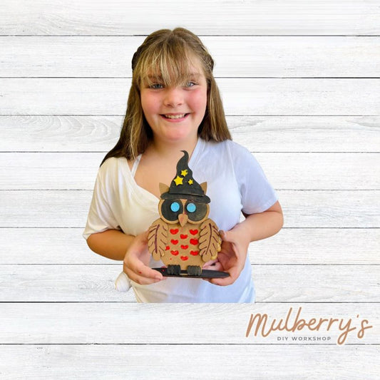 Every wizard needs an owl! Our adorable little wizard owl is approximately 8.5" tall and includes a stand.